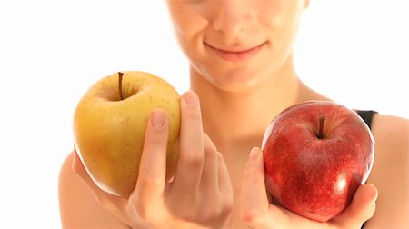 simsearch:400-04564926,k - Beautiful young woman with red and  yellow apple in her hands. Isolated over white Photographie de stock - Aubaine LD & Abonnement, Code: 400-04487974