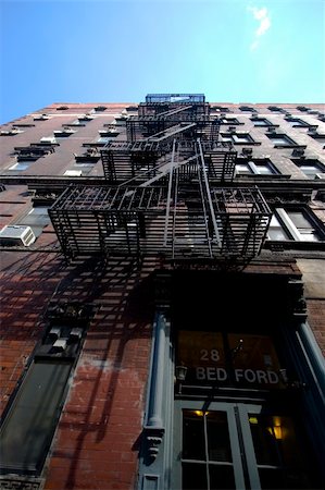 A typical brick building in the Village area of Manhattan, with classical firestairs facing the street. Stock Photo - Budget Royalty-Free & Subscription, Code: 400-04488281