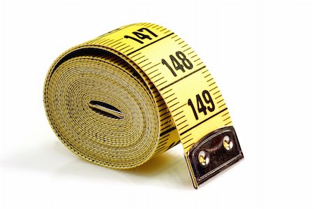 Close up of a coiled measuring tape Stock Photo - Budget Royalty-Free & Subscription, Code: 400-04489517