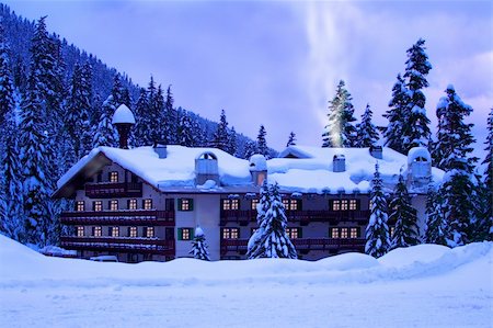 snow cosy - A hotel located in mountains covered by deep snow. Glow of windows and smoke give warm and cozy holiday feeling. Stock Photo - Budget Royalty-Free & Subscription, Code: 400-04489916