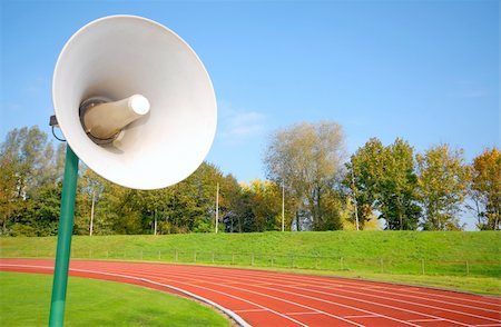 simsearch:400-03942081,k - Outdoor racetrack for runners. With close-up of speaker Foto de stock - Royalty-Free Super Valor e Assinatura, Número: 400-04480133