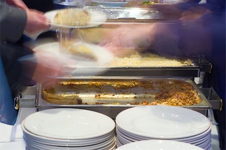 Motion blurred shot of food being served in a company canteen Stock Photo - Budget Royalty-Free & Subscription, Code: 400-04480221