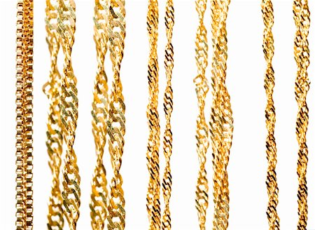simsearch:400-04499320,k - Gold chains close up isolated on white background Fotografie stock - Microstock e Abbonamento, Codice: 400-04480455