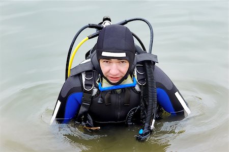 simsearch:400-04007432,k - Scuba diver in wet suit entering the cold water Stock Photo - Budget Royalty-Free & Subscription, Code: 400-04481585