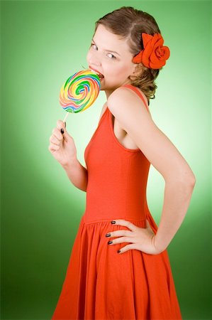 simsearch:400-03965656,k - girl in red with a rainbow lollipop Photographie de stock - Aubaine LD & Abonnement, Code: 400-04481979