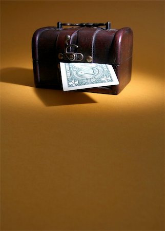 simsearch:400-07774250,k - Wood cashbox isolated on brown Stock Photo - Budget Royalty-Free & Subscription, Code: 400-04482469