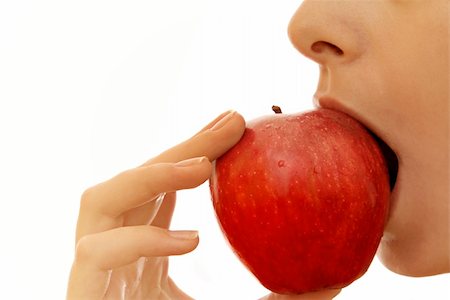 simsearch:400-04564052,k - Beautiful young woman eating red apple. Isolated over white Foto de stock - Super Valor sin royalties y Suscripción, Código: 400-04482518