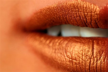 simsearch:400-05676902,k - Macro blur image of bright lips -gold lipstik Stock Photo - Budget Royalty-Free & Subscription, Code: 400-04482565