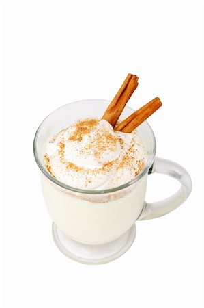 A frothy mug of holiday eggnog garnished with a dollop of whipped cream, nutmeg and cinnamon sticks.  Isolated with clipping path. Photographie de stock - Aubaine LD & Abonnement, Code: 400-04482796