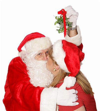 simsearch:400-04636742,k - Santa is getting a kiss under the mistletoe at the Christmas party in the North Pole. Foto de stock - Royalty-Free Super Valor e Assinatura, Número: 400-04482799