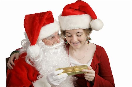 simsearch:400-04636742,k - A girl sitting on Santa's lap and receiving a gift. Foto de stock - Royalty-Free Super Valor e Assinatura, Número: 400-04482859