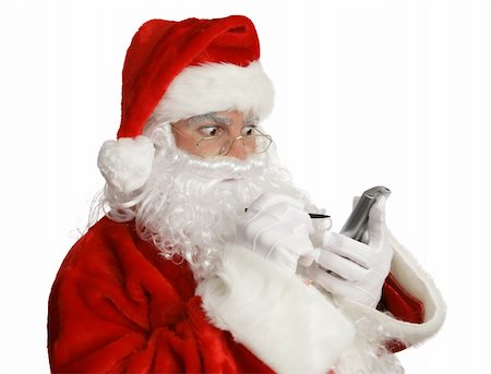 simsearch:400-04636742,k - Santa Clause checking his naughty list on his pda.  Isolated. Foto de stock - Royalty-Free Super Valor e Assinatura, Número: 400-04482864