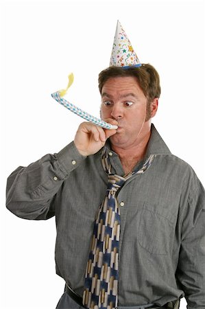 A man at a party, wearing a party hat and blowing a noisemaker. Stock Photo - Budget Royalty-Free & Subscription, Code: 400-04482877