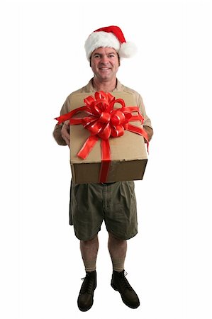 A full view of a delivery man with a Santa hat delivering a gift - isolated Stock Photo - Budget Royalty-Free & Subscription, Code: 400-04482885