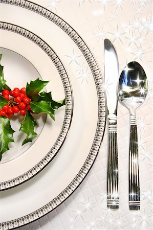 Silver plate setting with a sprig of holly and stars Stock Photo - Budget Royalty-Free & Subscription, Code: 400-04482898