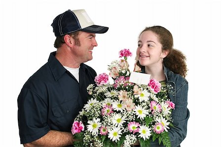 simsearch:400-03967457,k - A cute teen girl receiving a bouquet of flowers from a delivery man. Isolated. Foto de stock - Royalty-Free Super Valor e Assinatura, Número: 400-04483030