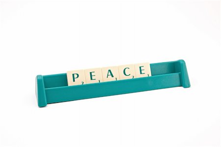 pees (artist) - Peace inscription made of plastic letters on white background Photographie de stock - Aubaine LD & Abonnement, Code: 400-04483281