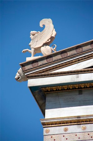 simsearch:400-06478037,k - neoclassical architecture details decoration sculptures and shinx statue on the roof Foto de stock - Royalty-Free Super Valor e Assinatura, Número: 400-04483838