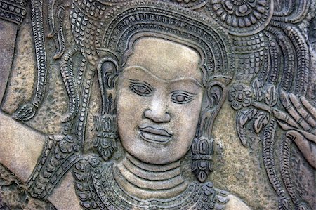 Traditional Thai stone carving on a wall - travel and tourism. Stock Photo - Budget Royalty-Free & Subscription, Code: 400-04483860