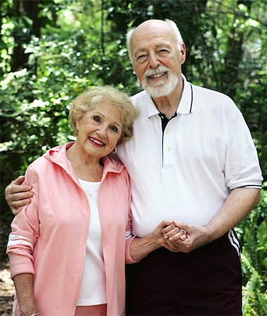 A portrait of a loving senior couple holding hands outdoors. Stock Photo - Budget Royalty-Free & Subscription, Code: 400-04483970