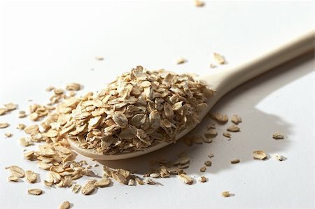 quaker - raw oatmeal in the wood spoon Foto de stock - Royalty-Free Super Valor e Assinatura, Número: 400-04494254