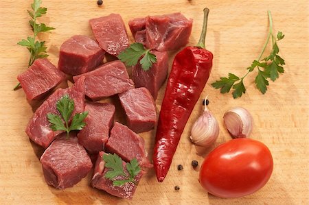 simsearch:400-07713408,k - shards of meat with vegetables on the wood board Stock Photo - Budget Royalty-Free & Subscription, Code: 400-04494259