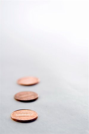 Row of pennies with a shallow depth of field Foto de stock - Royalty-Free Super Valor e Assinatura, Número: 400-04494621