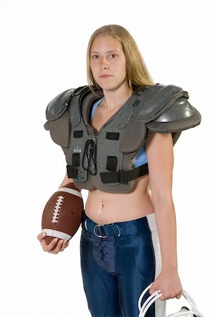 Female football player in shoulder pads holding football. Stock Photo - Budget Royalty-Free & Subscription, Code: 400-04494908