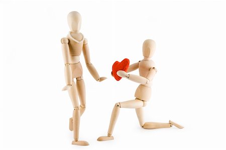 simsearch:400-05294518,k - Little wooden Man offering his heart to a little wooden woman. Valentine's day card. Isolated on white background.  Clipping path included. Fotografie stock - Microstock e Abbonamento, Codice: 400-04495098