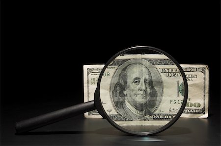 simsearch:693-06021344,k - A 100 dollar bill under a magnifying glass. Stockbilder - Microstock & Abonnement, Bildnummer: 400-04495755