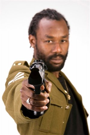 simsearch:400-05030782,k - A Black man in a Army jacket with a gun isolated on a white background. Stock Photo - Budget Royalty-Free & Subscription, Code: 400-04495765