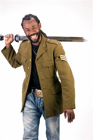 simsearch:693-03363711,k - A Black man in a Army jacket with a sword isolated on a white background. Stockbilder - Microstock & Abonnement, Bildnummer: 400-04495768