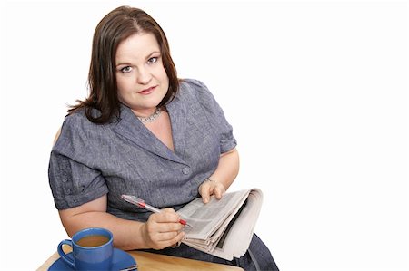 Plus-sized businesswoman reads classifieds, discouraged by poor job market.  Isolated on white. Stock Photo - Budget Royalty-Free & Subscription, Code: 400-04495900