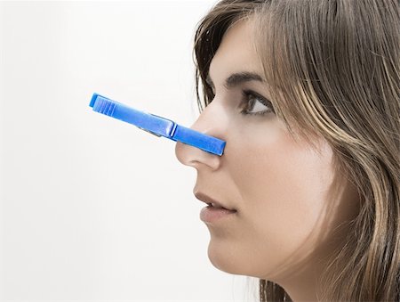 simsearch:400-04520503,k - Woman with clothespin in the nose Stock Photo - Budget Royalty-Free & Subscription, Code: 400-04496297
