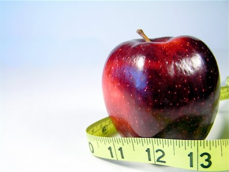 simsearch:400-08532856,k - Apple on white with measuring tape signifying weight watching or weight loss Stock Photo - Budget Royalty-Free & Subscription, Code: 400-04496348