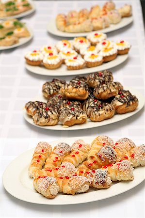 Several plates with various sweet cakes and pies Stock Photo - Budget Royalty-Free & Subscription, Code: 400-04496521