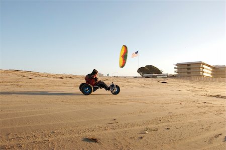 A man kite buggying at the beach at sunset Stock Photo - Budget Royalty-Free & Subscription, Code: 400-04496769