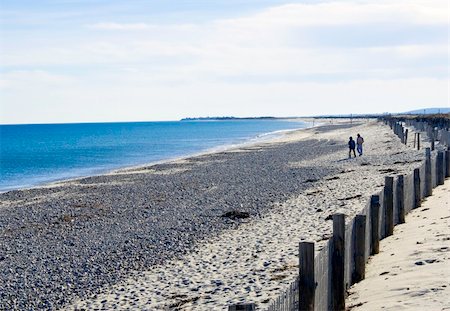 Hikers start the long walk to Gurnet Point Stockbilder - Microstock & Abonnement, Bildnummer: 400-04496814