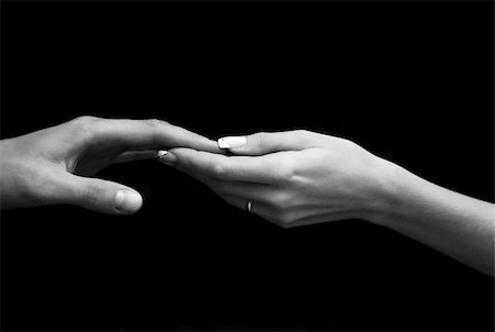 Man's and female hand on a black background Stock Photo - Budget Royalty-Free & Subscription, Code: 400-04497106