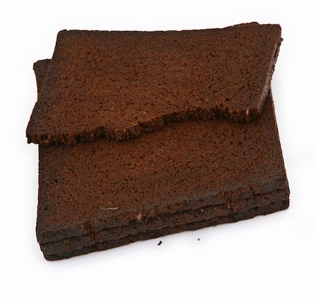 simsearch:400-04497847,k - close-up of pumpernickel bread against white background, minimal shadow in front Stockbilder - Microstock & Abonnement, Bildnummer: 400-04497797