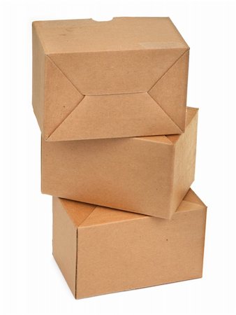 simsearch:700-02637506,k - close-up of three cardboard boxes againt white background Photographie de stock - Aubaine LD & Abonnement, Code: 400-04497802