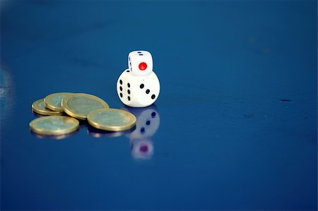 simsearch:400-04880391,k - dice and coins over blue background Photographie de stock - Aubaine LD & Abonnement, Code: 400-04498725