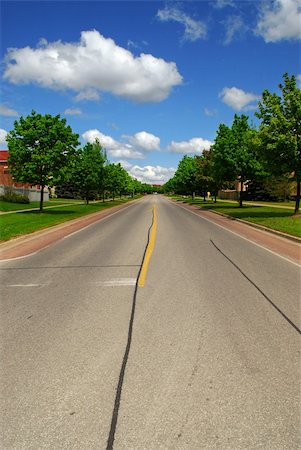 simsearch:400-04164106,k - Empty residential street in suburban neighborhood lined with trees Stock Photo - Budget Royalty-Free & Subscription, Code: 400-04499036