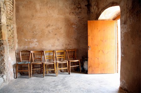 chairs inside a chapel in crete Foto de stock - Super Valor sin royalties y Suscripción, Código: 400-04499092