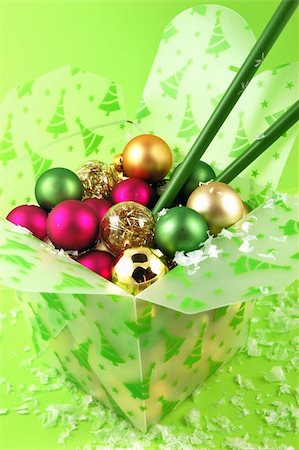 Christmas ornaments in a take-out food container with chopsticks on a lime green background Stock Photo - Budget Royalty-Free & Subscription, Code: 400-04499158