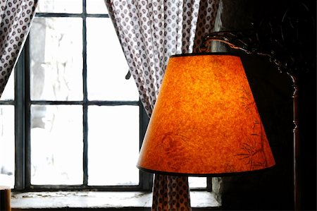 snow cosy - Warm colored lamp near a window looking out onto a winter scenic Stock Photo - Budget Royalty-Free & Subscription, Code: 400-04499176