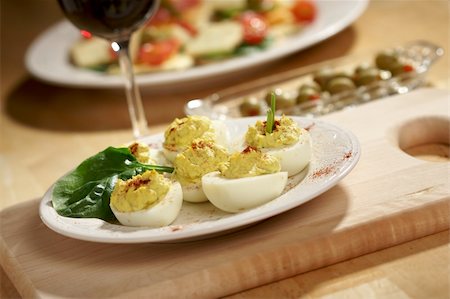 deviled egg - Deviled Eggs and Appetizers on a Decorative White Plate. Stock Photo - Budget Royalty-Free & Subscription, Code: 400-04490186