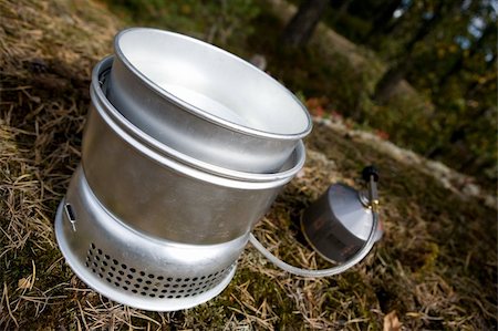 A camp stove cooking water in the forest with pressurized gas Stock Photo - Budget Royalty-Free & Subscription, Code: 400-04490333