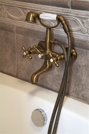 simsearch:400-04026996,k - The beautiful bronze faucet in a bathroom Stock Photo - Budget Royalty-Free & Subscription, Code: 400-04490684