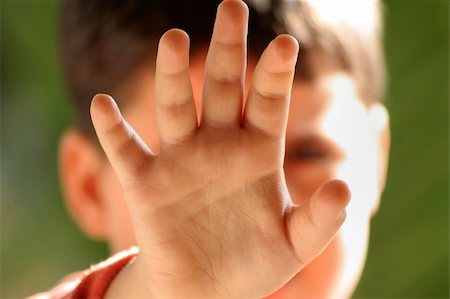 image of a  boy,focus is on the hand shallow DOF conceptual shot representing child care Stockbilder - Microstock & Abonnement, Bildnummer: 400-04491866